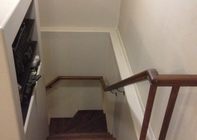 Winder Staircase With Continuous Wall Mount Railing.