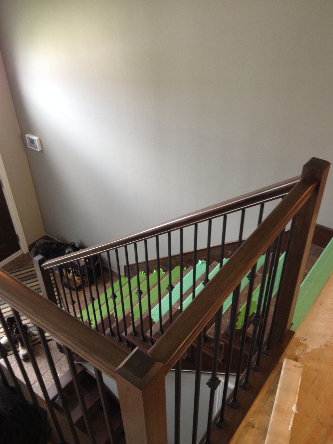 Stained maple railing renovation with black metal spindles | KP Carpentry